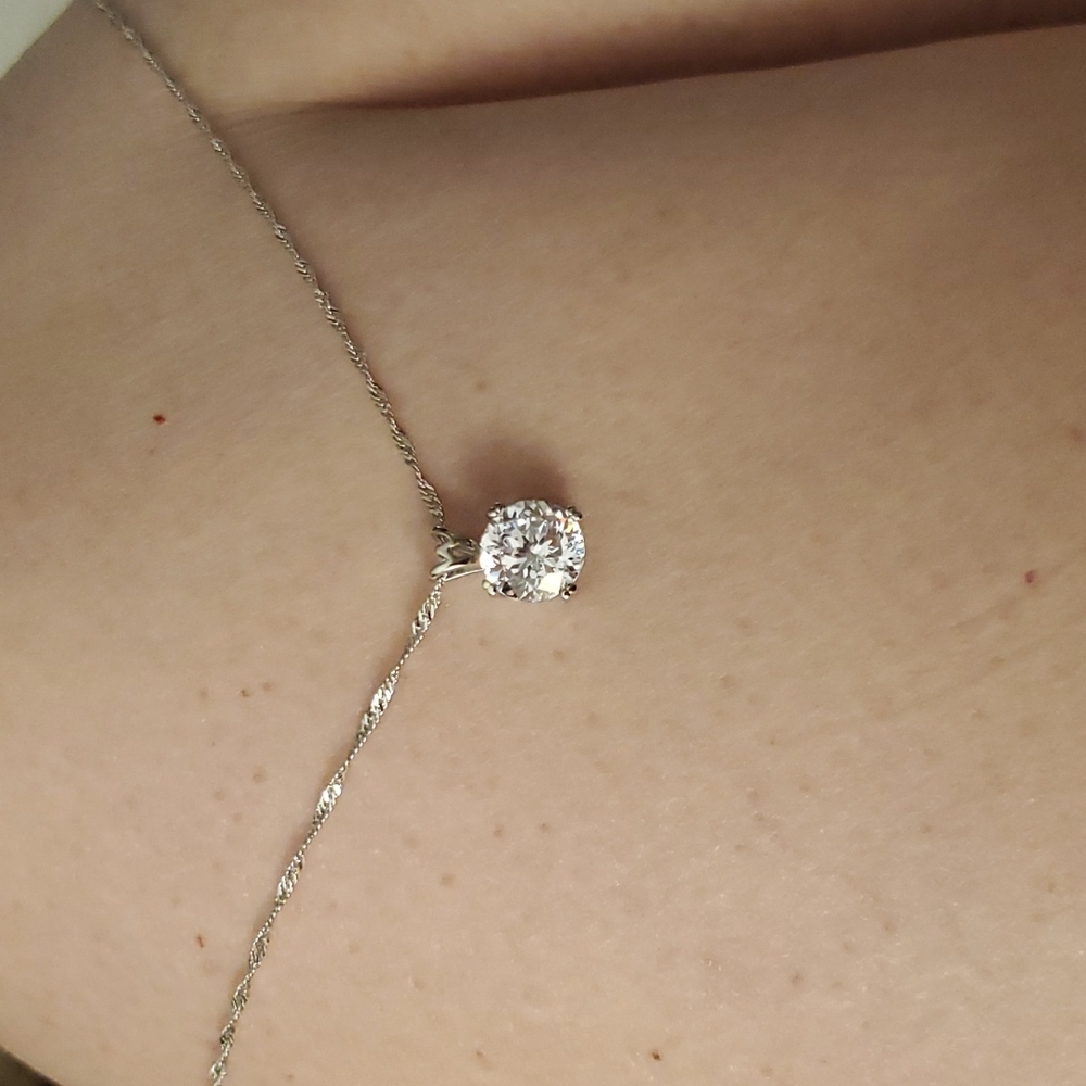 Diamond simulate set in silver necklace.